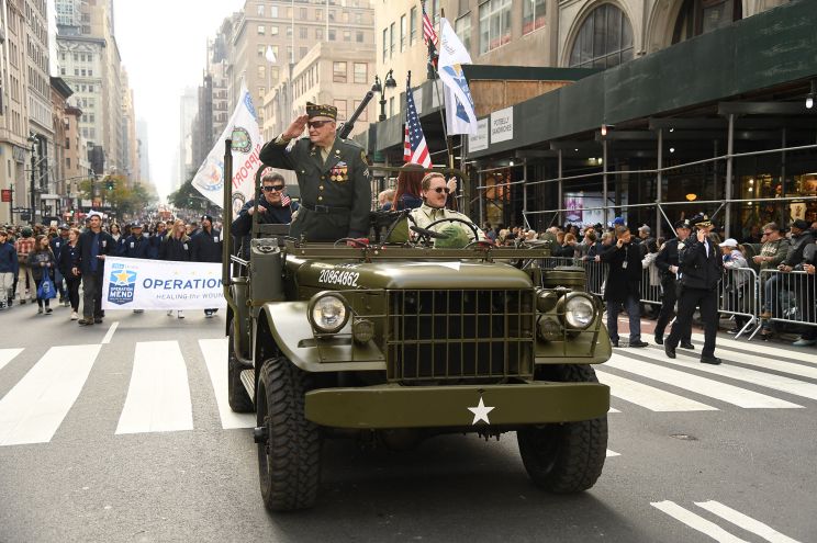 Many veterans wave to civilians during the New York City Veterans Day parade Nov. 11, 2021.