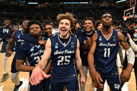 Saint Peter’s celebrates shocking upset against two-seeded Kentucky in the first round of the tournament. 6.01% people chose Kentucky to win the national championship, while only 3.04% of people chose Saint Peter’s to win in the first round.