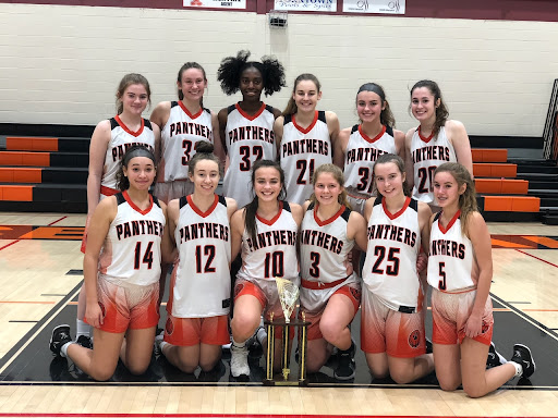 The varsity girls basketball team with the trophy for the Panther Holiday Celebration Dec. 28, 2021. This season ended with another visit to the state tournament. “The girls do an excellent job and really focus on the information we gather and share,“ said Wisner.
