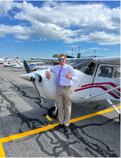 Christian Bucks on Sept. 13, 2022 at Lancaster Airport (LNS) in front of the plant he flew in his pilots license test, cheerful for the new responsibility in his life that he just achieved in his young career as a pilot.