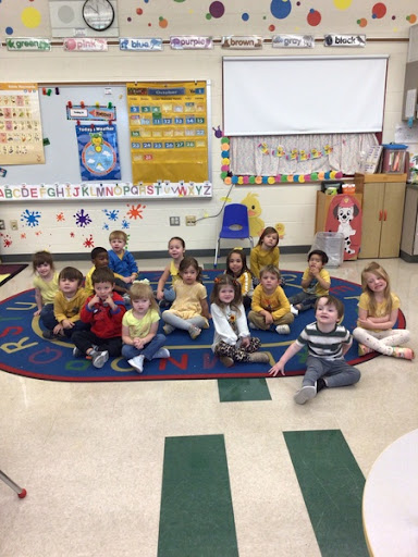 Preschool students participate in color war day for homecoming spirit week. 