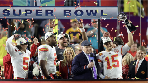 Following the Kansas City Chiefs win MVP QB Patrick Mahomes celebrated by  hoisting the Super Bowl Trophy alongside his teammates.

