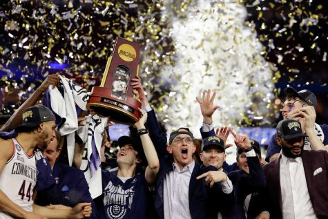 Uconn head coach Dan Hurley celebrates the National Championship victory with his team.
