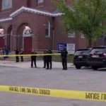 Police tape blocks a Milwaukee street near the scene of a shooting investigation