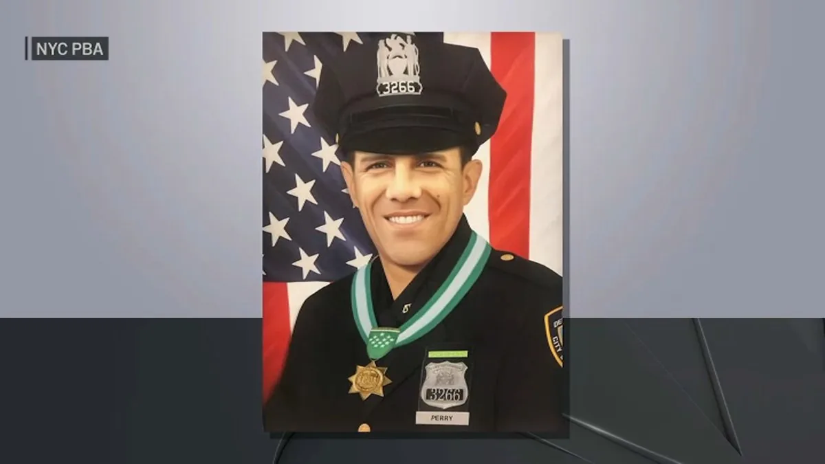 Street sign in East Harlem honoring NYPD officer John William Perry
