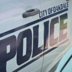 Police investigate an alley in Oakdale after a late-night shooting