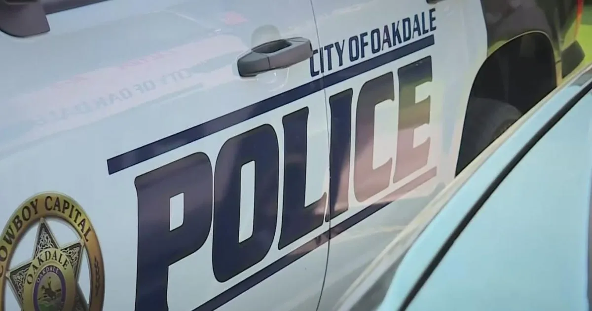 Police investigate an alley in Oakdale after a late-night shooting